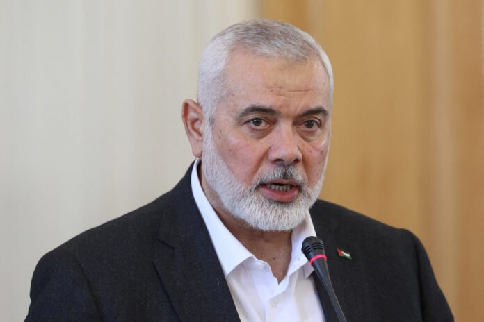 FILE PHOTO: Palestinian group Hamas' top leader, Ismail Haniyeh and Iran's Foreign Minister Hossein Amir Abdollahian attend a press conference in Tehran